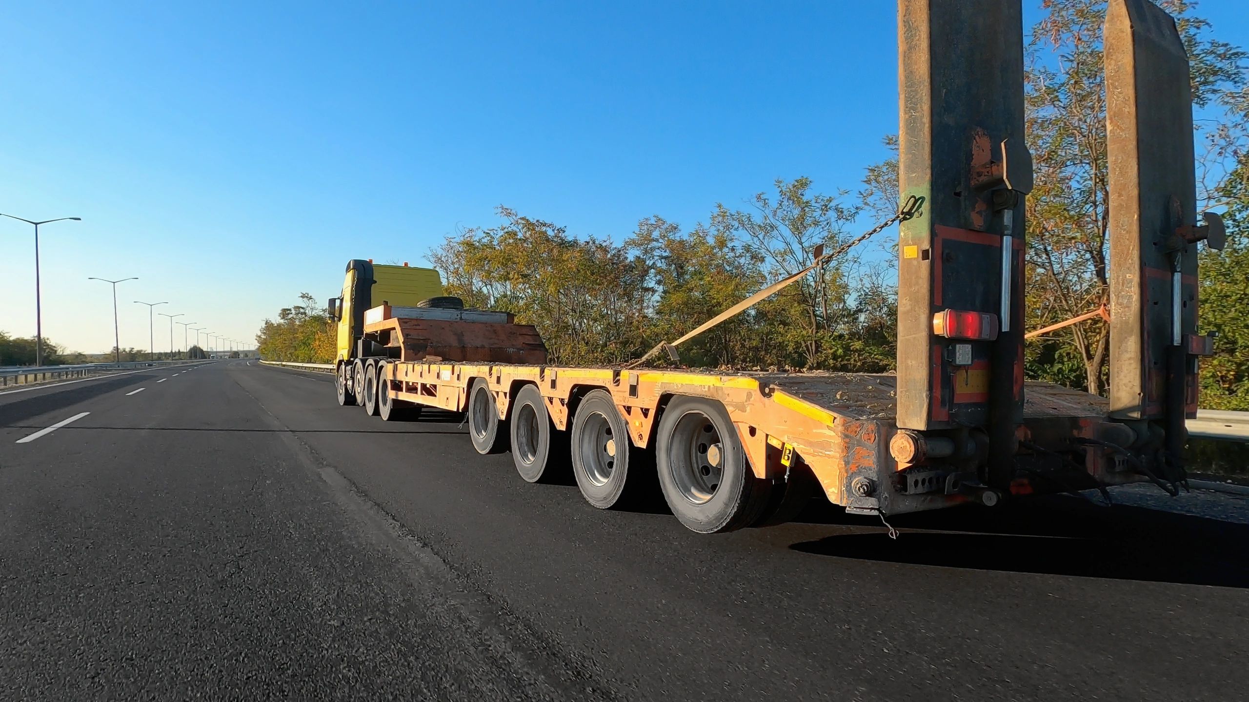 Heavy equipment being transported on a truck for delivery