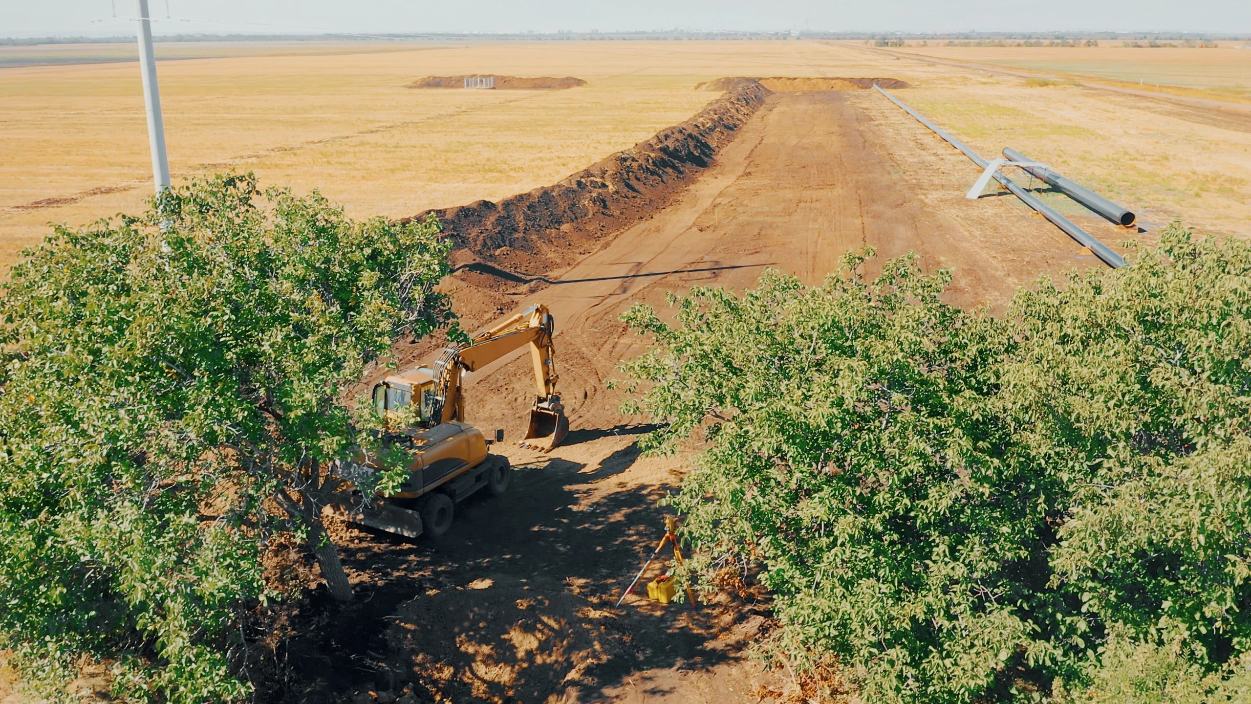 Excavator working on a trench construction site